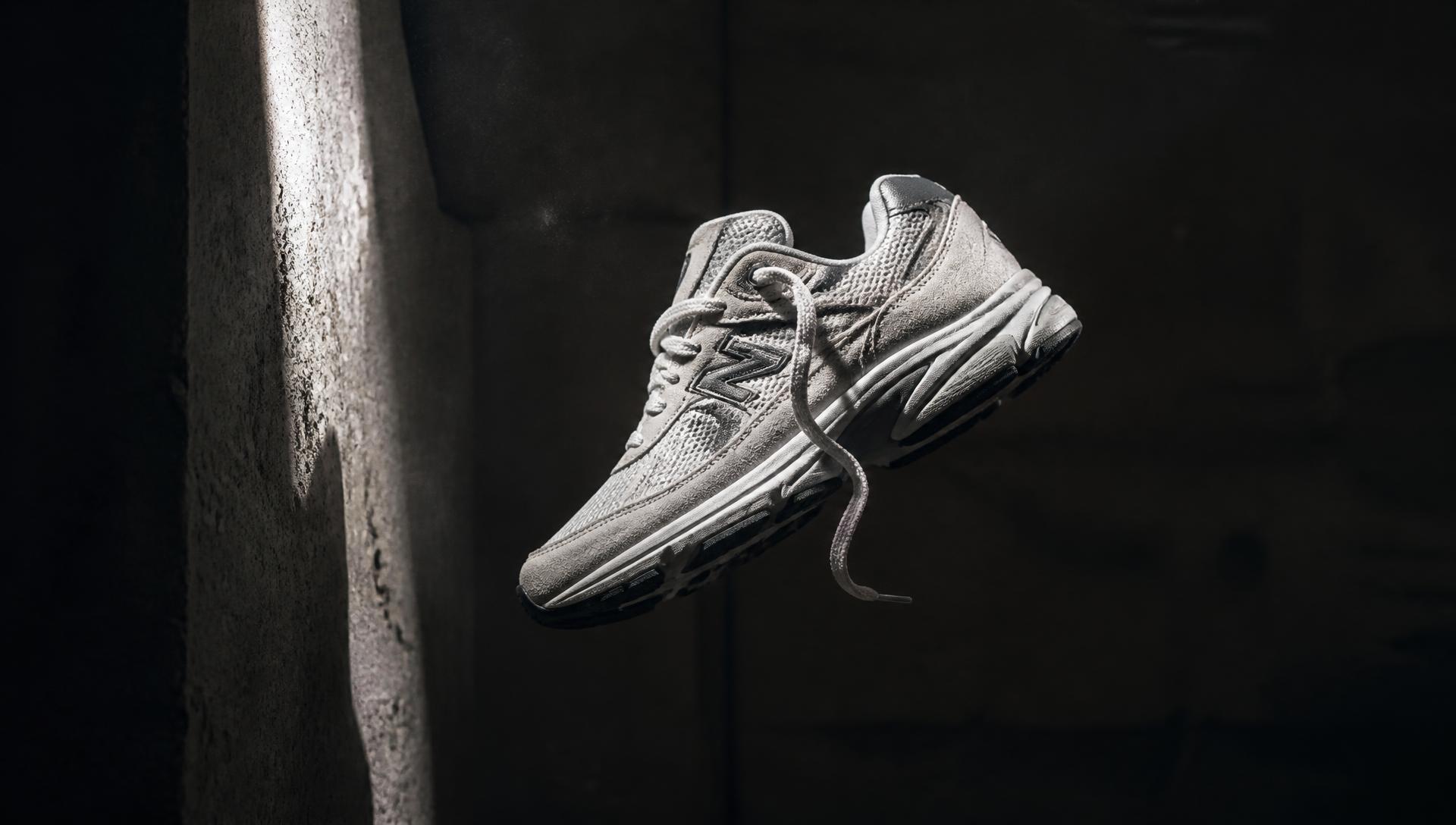Grey suede runner suspended in dramatic light